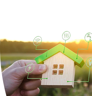 Mano sosteniendo una casa de madera en miniatura con íconos que representan servicios como electricidad, agua, gas, internet e iluminación