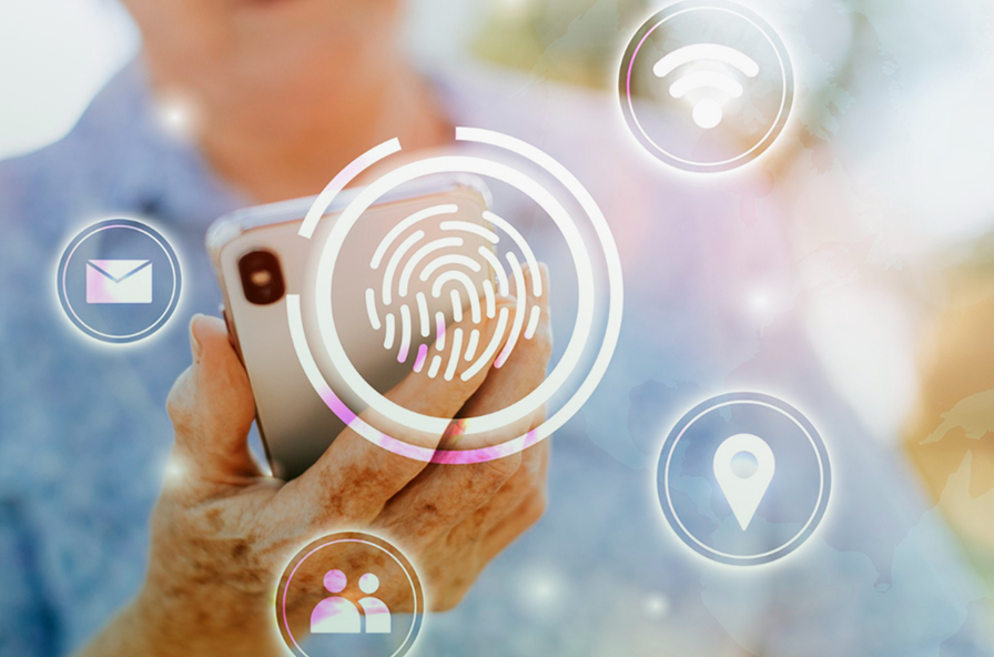 Mano sosteniendo un celular mientras, se visualiza una huella de identidad y otros elementos digitales