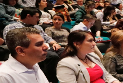 crowd of people in a conference.